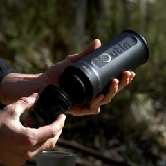 Outin Nano Space Grey held in hand